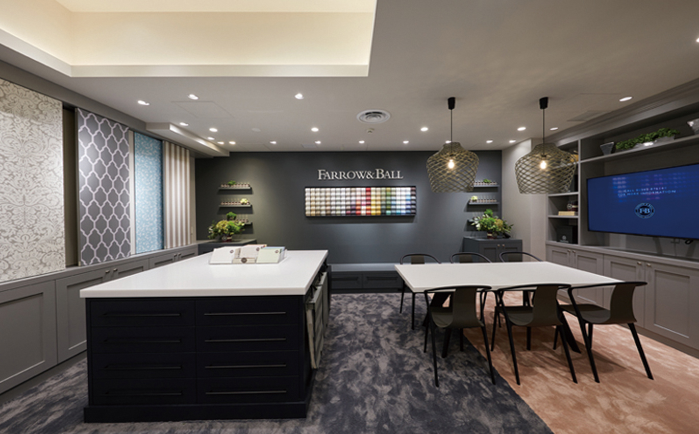 A Farrow & Ball showroom with a wall of colour swatches